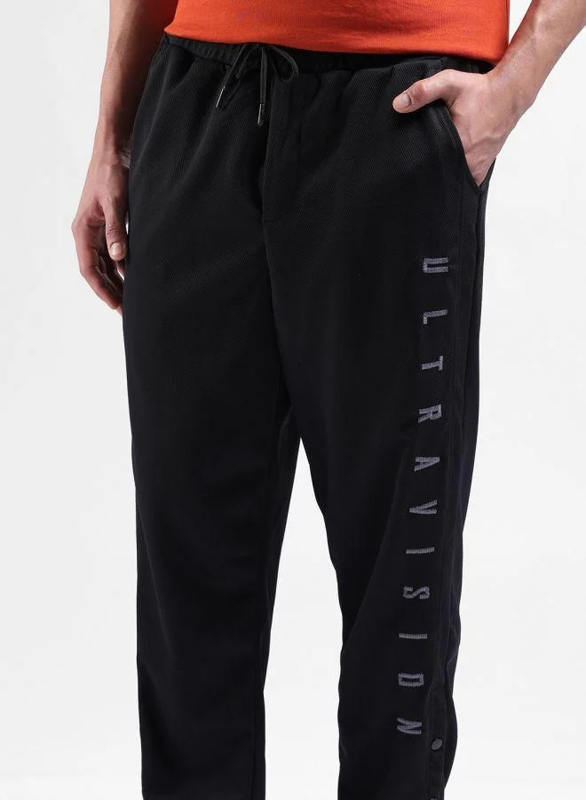 The Indian Garage Co  Men Relaxed Fit Embroidered Side Pocket Mid-Rise Joggers for Men | Best Price UAE